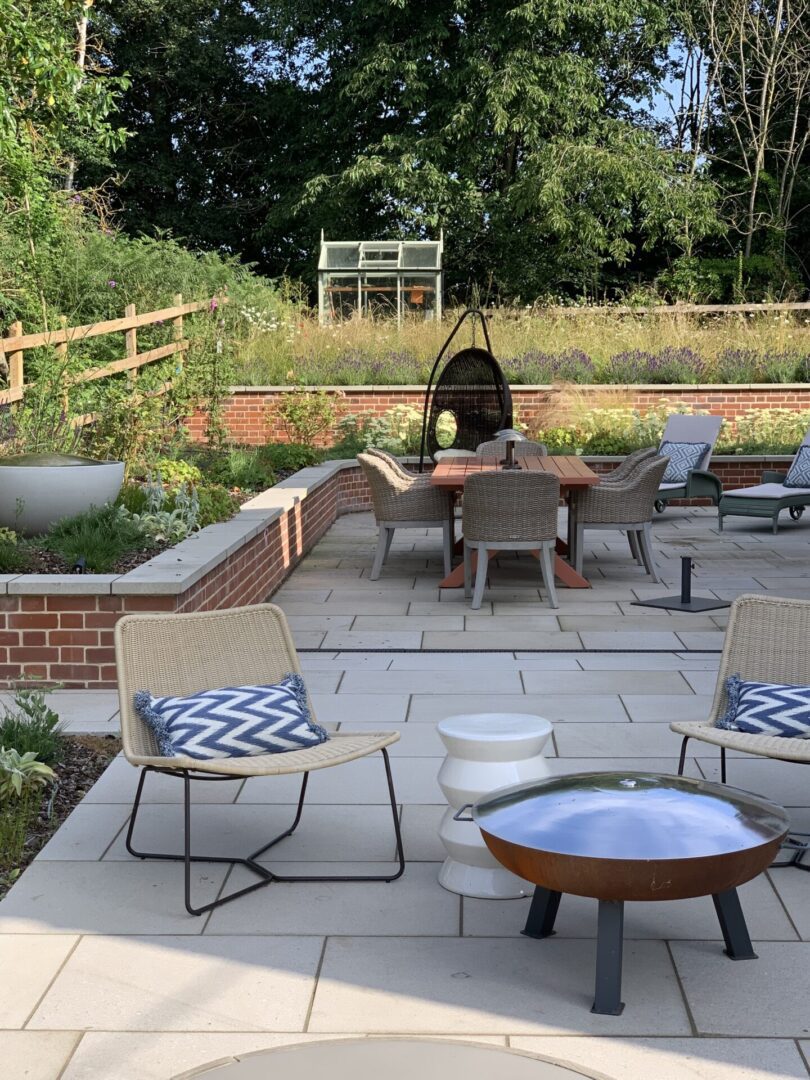 A patio with chairs and tables in it