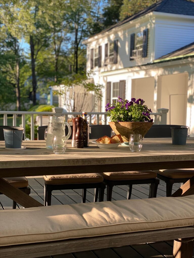 A table with flowers and vases on it