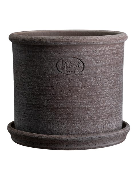 A gray planter with a saucer on top of it.