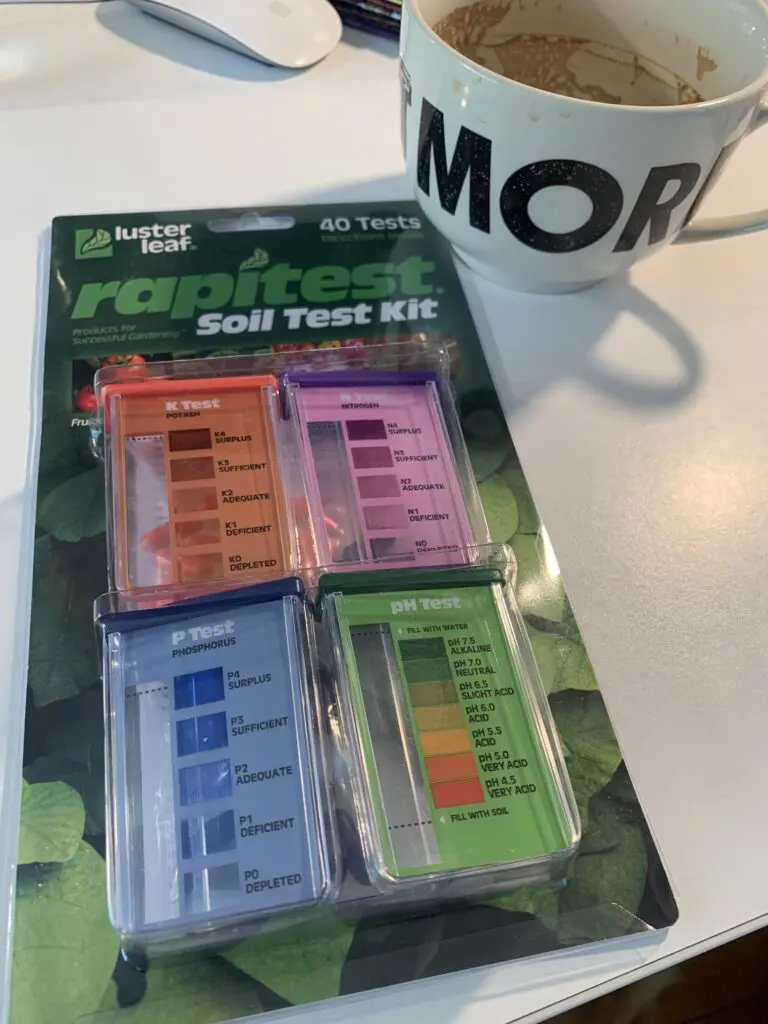 A set of four different soil test kits.