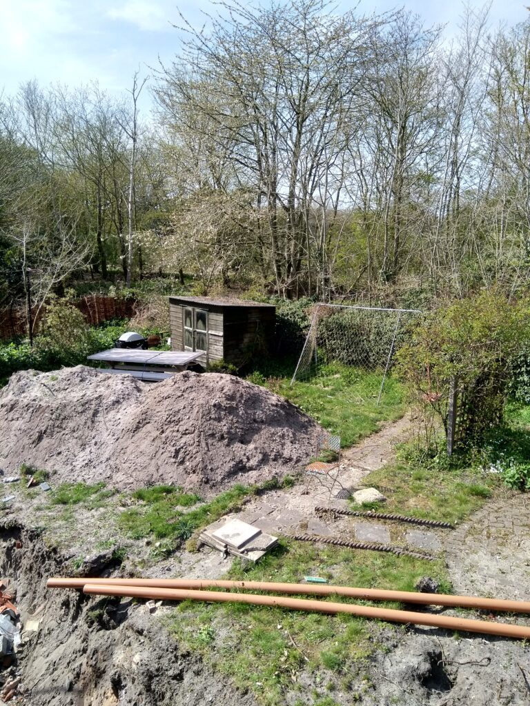 A large pile of dirt in the middle of a field.