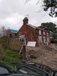 A house that is being built in the yard.